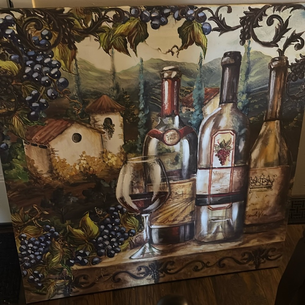 This is a portrait of wine and glasses in a vineyard.